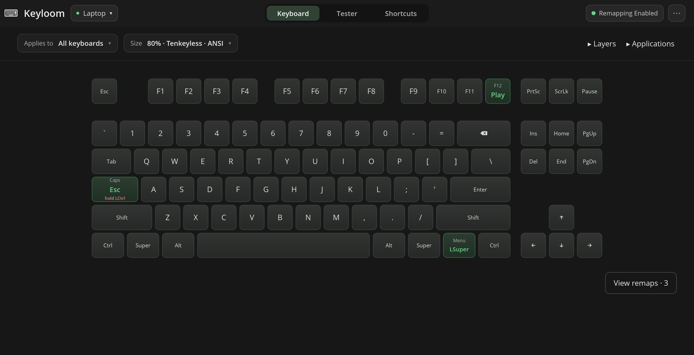 Keyloom's main window showing a tenkeyless keyboard. Caps Lock is remapped to Escape and holds Control, the Menu key is Super, and F12 is Play/Pause.